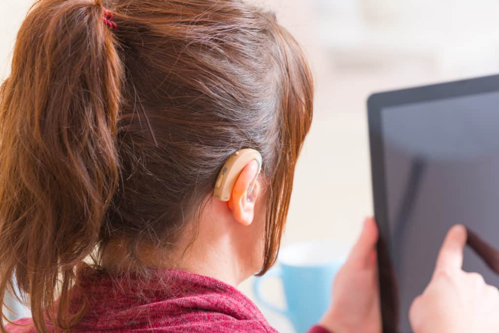 Deaf woman using tablet